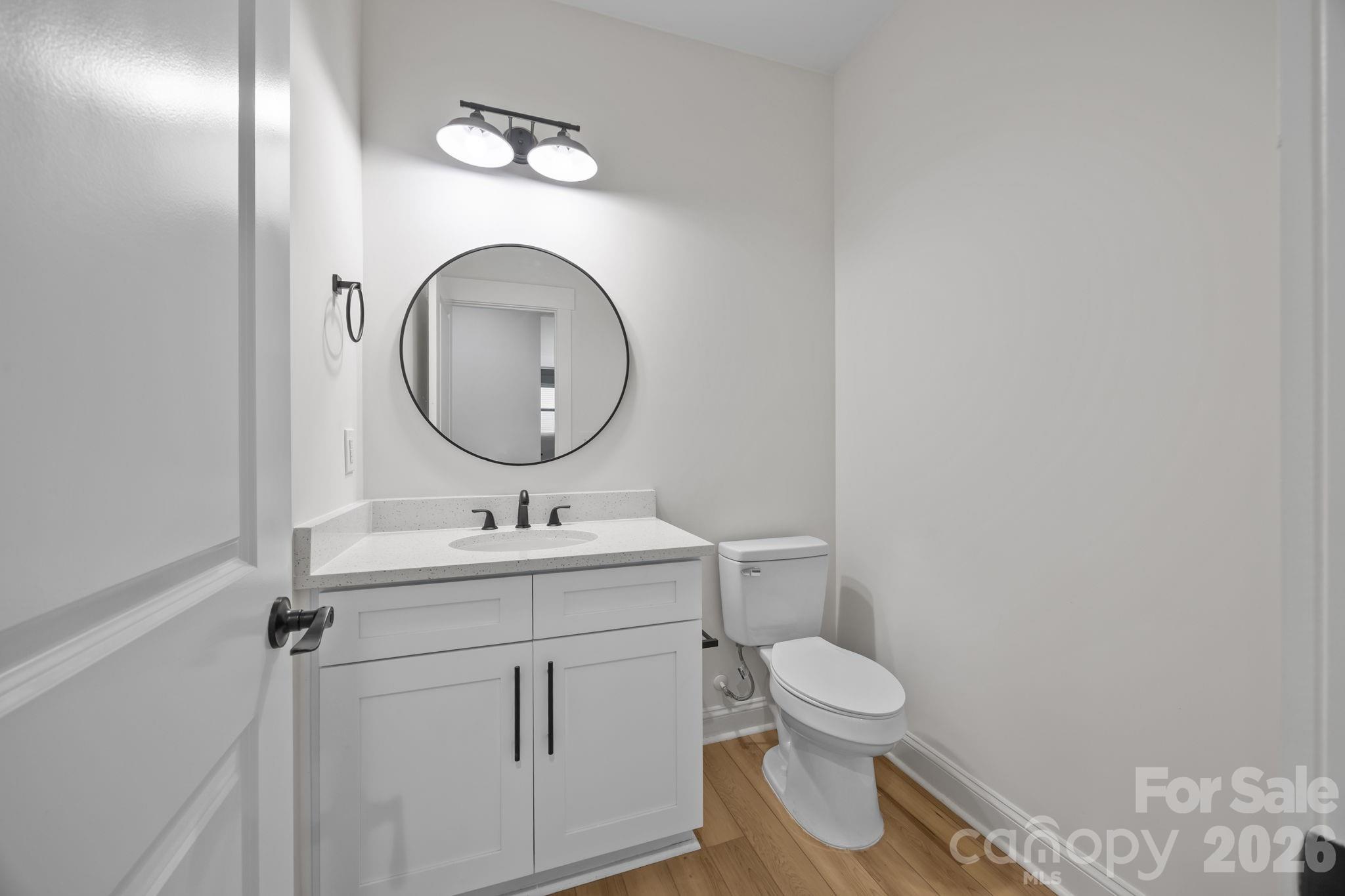 1030 Gibson Road Salisbury, NC 28147 - Photo 10 of 47 a bathroom with a toilet sink and mirror
