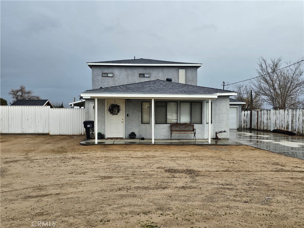 a view of a house with wooden floor and a yard