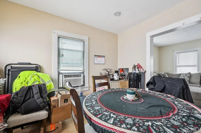 a living room with furniture and a lamp