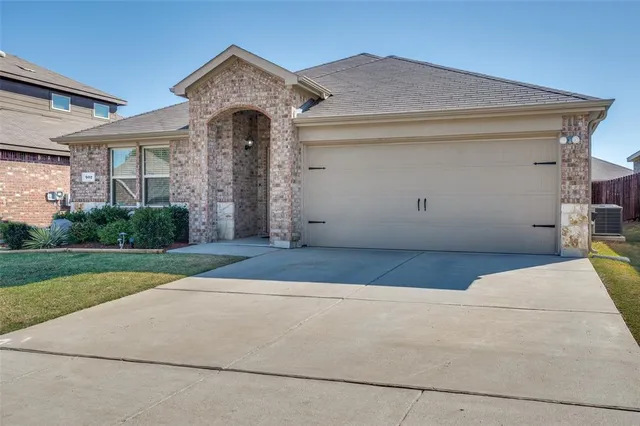 a front view of a house with yard
