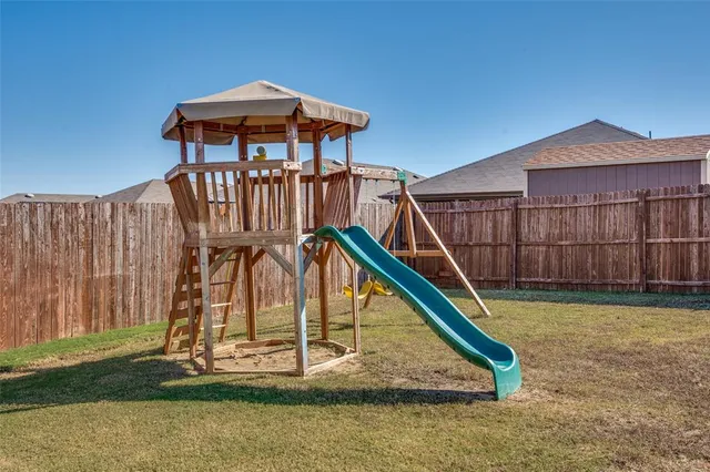 a view of a wooden deck with a swimming pool
