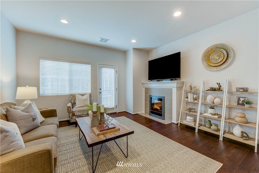 3010 34th Place Everett, WA 98201 - Photo 2 of 39 a living room with furniture a fireplace and a flat screen tv