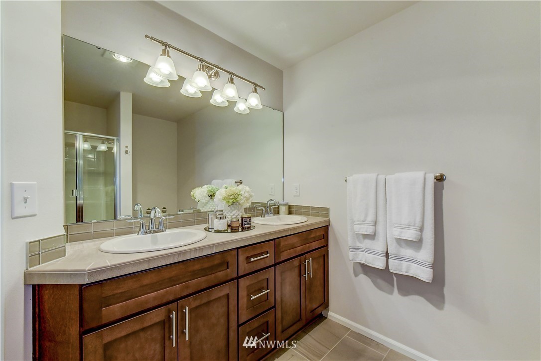3010 34th Place Everett, WA 98201 - Photo 13 of 39 a bathroom with a sink and a mirror