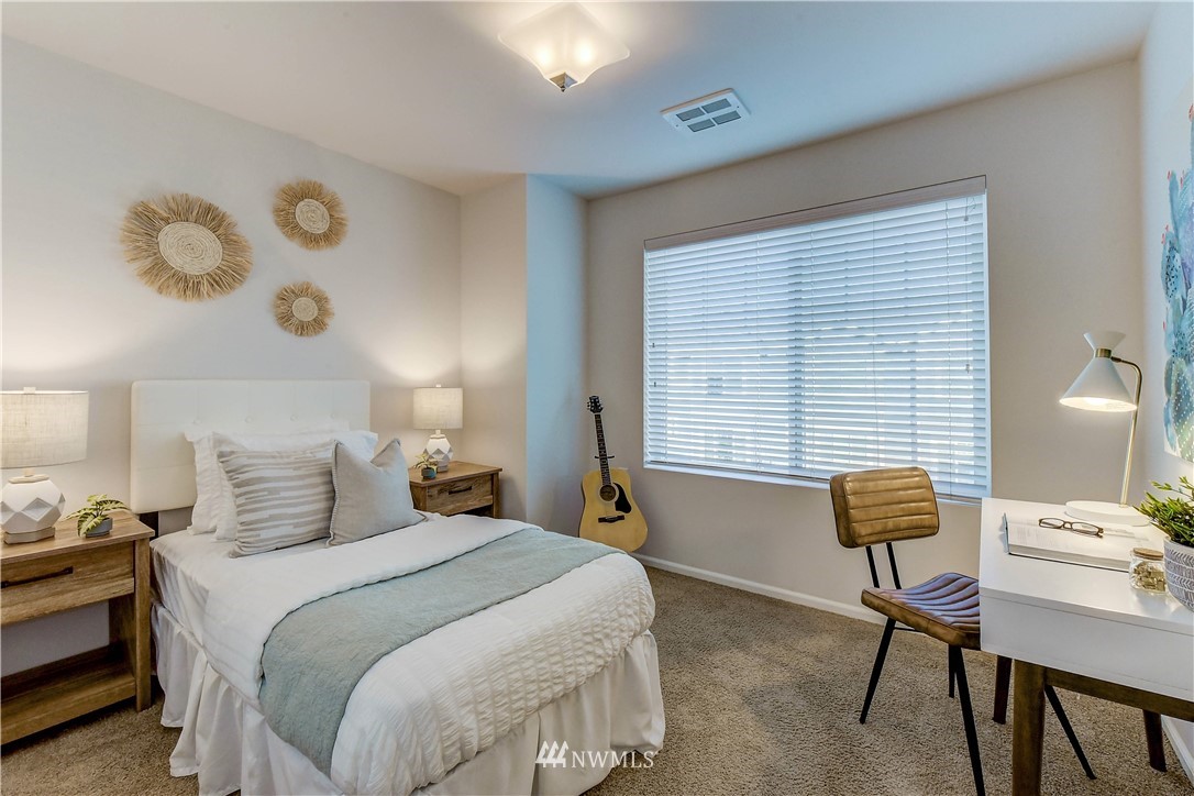3010 34th Place Everett, WA 98201 - Photo 15 of 39 a bedroom with a bed and a chair