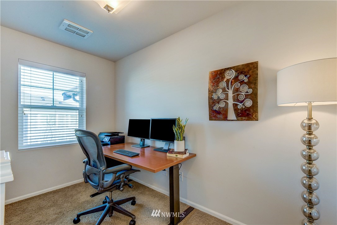 3010 34th Place Everett, WA 98201 - Photo 17 of 39 a view of a workspace with furniture and a window