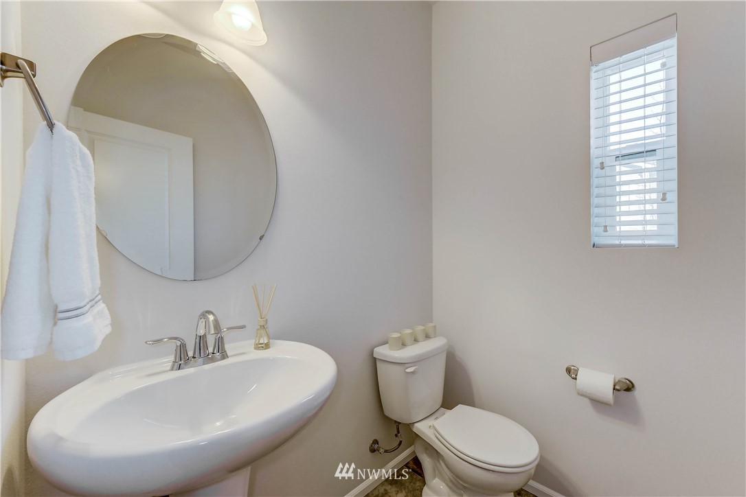3010 34th Place Everett, WA 98201 - Photo 20 of 39 a bathroom with a sink a toilet and mirror