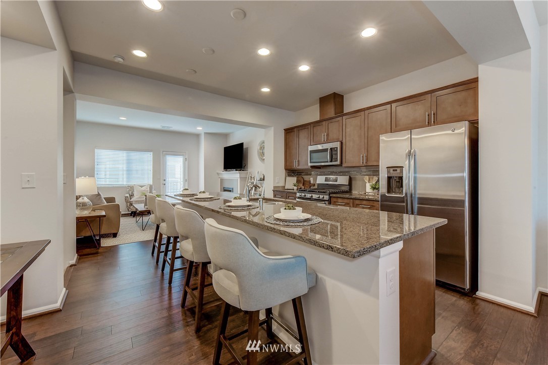 3010 34th Place Everett, WA 98201 - Photo 4 of 39 a kitchen with counter space dining table and chairs