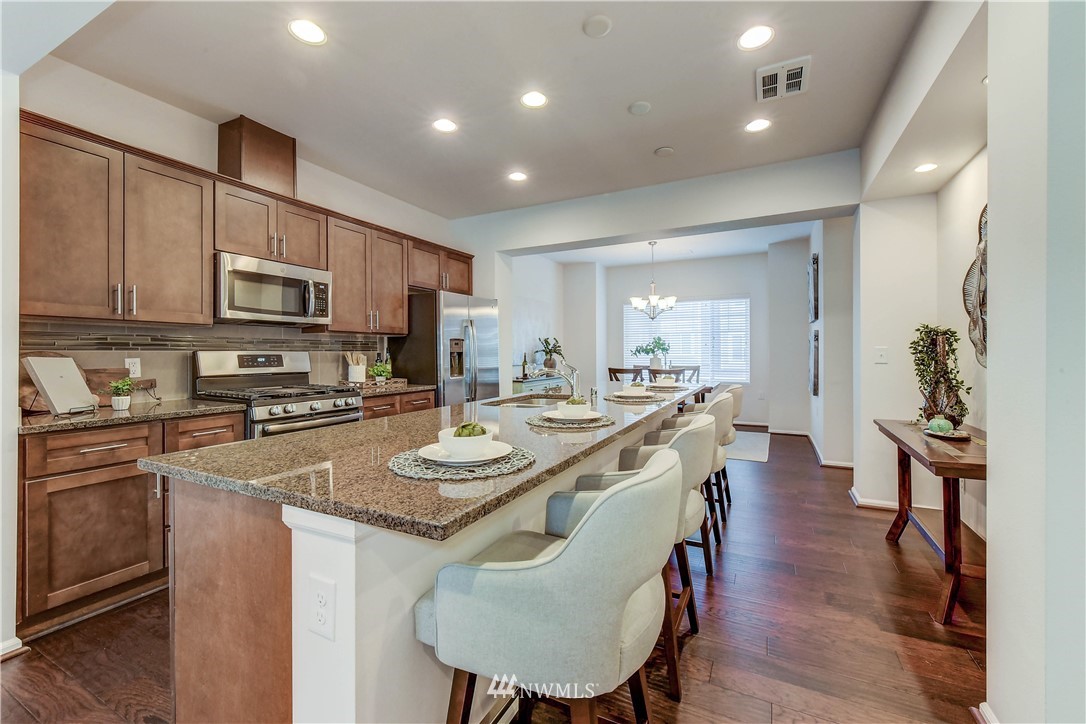 3010 34th Place Everett, WA 98201 - Photo 5 of 39 a kitchen with sink a microwave and refrigerator