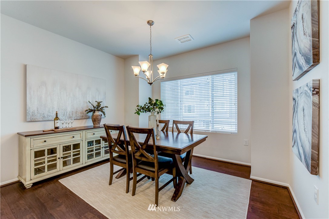 3010 34th Place Everett, WA 98201 - Photo 10 of 39 a view of a dining room with furniture and wooden floor