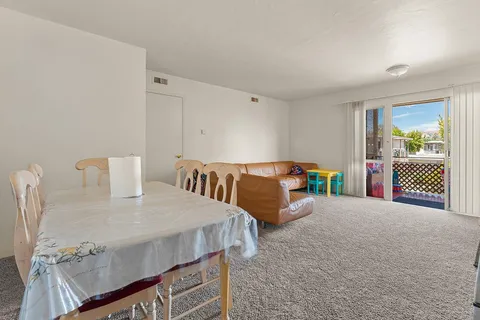 a living room with furniture and a table