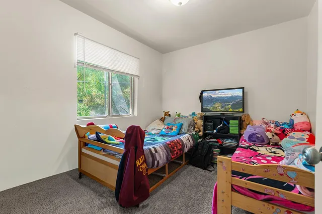 a room with toys and a wooden floor