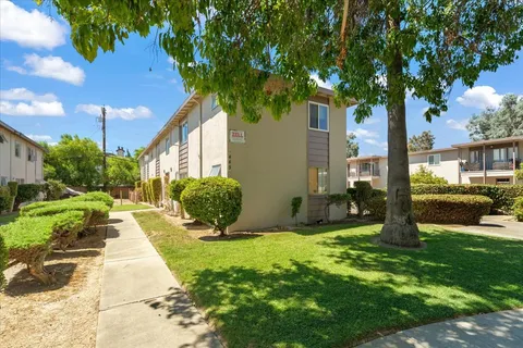 a front view of a house with garden