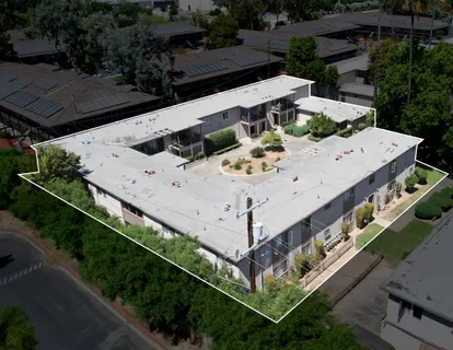 a view of a roof with sitting area