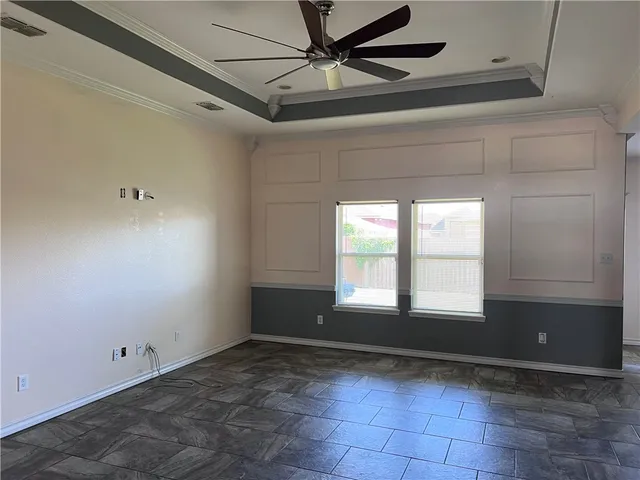 a dining room with a table and chairs