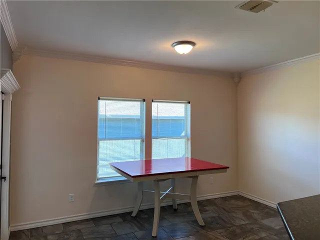 a view of room with window and wooden floor
