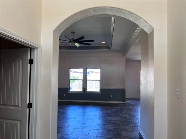 a kitchen with stainless steel appliances granite countertop a sink a stove and a refrigerator