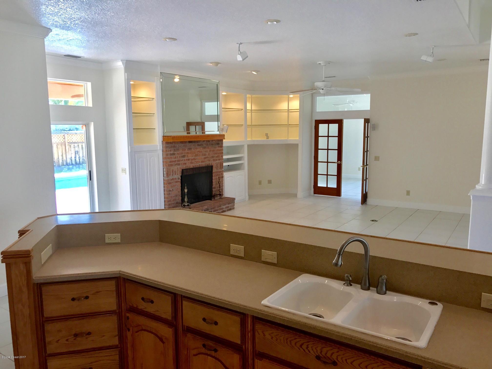 401 Rio Villa Boulevard Melbourne, FL 32903 - Photo 5 of 19 top kitchen to family room