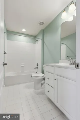 a bathroom with a sink a toilet and bathtub