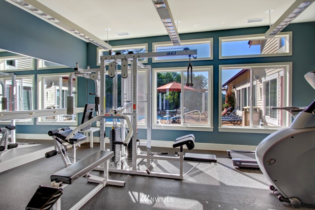 3921 243rd Place Southeast, Unit J202 Bothell, WA 98021 - Photo 14 of 16 a room with gym equipment and a large window