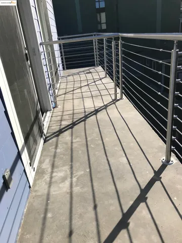 a kitchen with granite countertop a refrigerator and a stove top oven