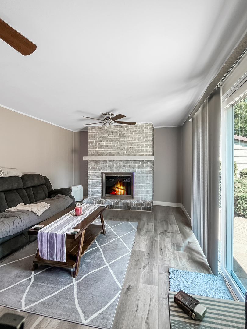 985 Greenridge Road Buffalo Grove, IL 60089 - Photo 6 of 20 a bedroom with a bed and a fireplace