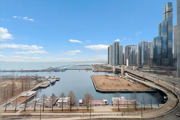 a view of a lake with tall buildings