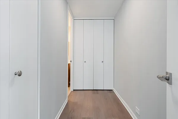 a view of a hallway with closet