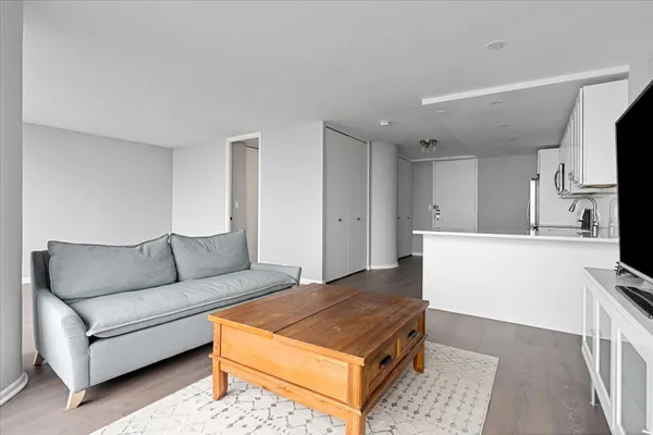 a living room with a couch and a flat screen tv