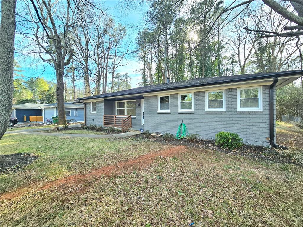 3529 Misty Valley Road Decatur, GA 30032 - Photo 1 of 1 a backyard of a house with oven table and chairs