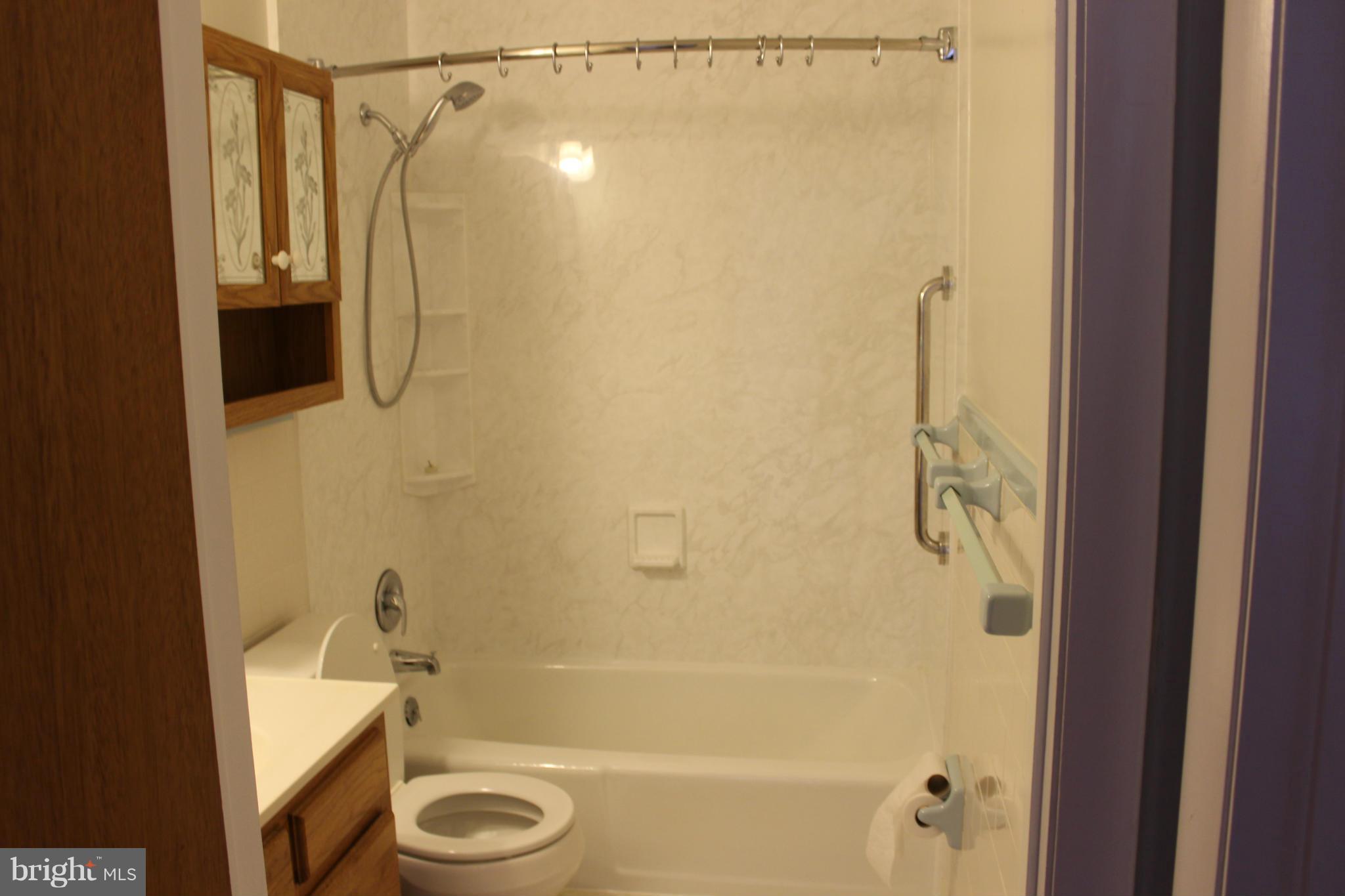 7016 Gaymount Road Baltimore, MD 21244 - Photo 8 of 20 a bathroom with a shower and a tub