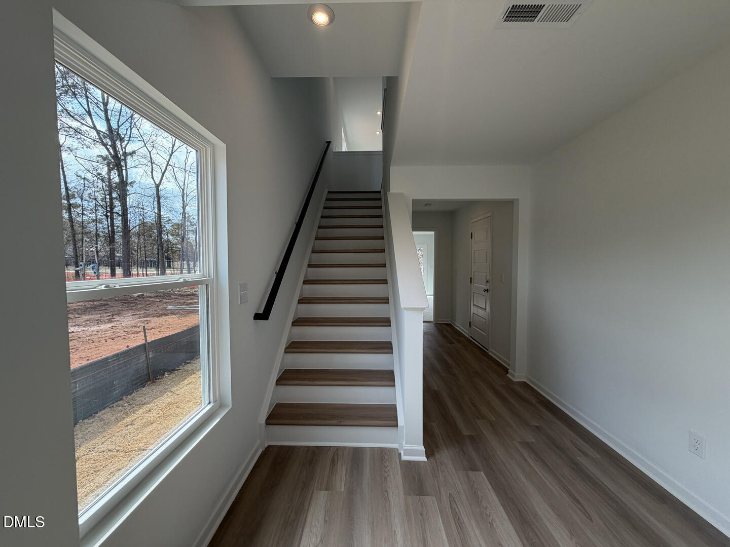 3328 Bomore Road Raleigh, NC 27610 - Photo 11 of 47 a view of entryway and hall with wooden floor