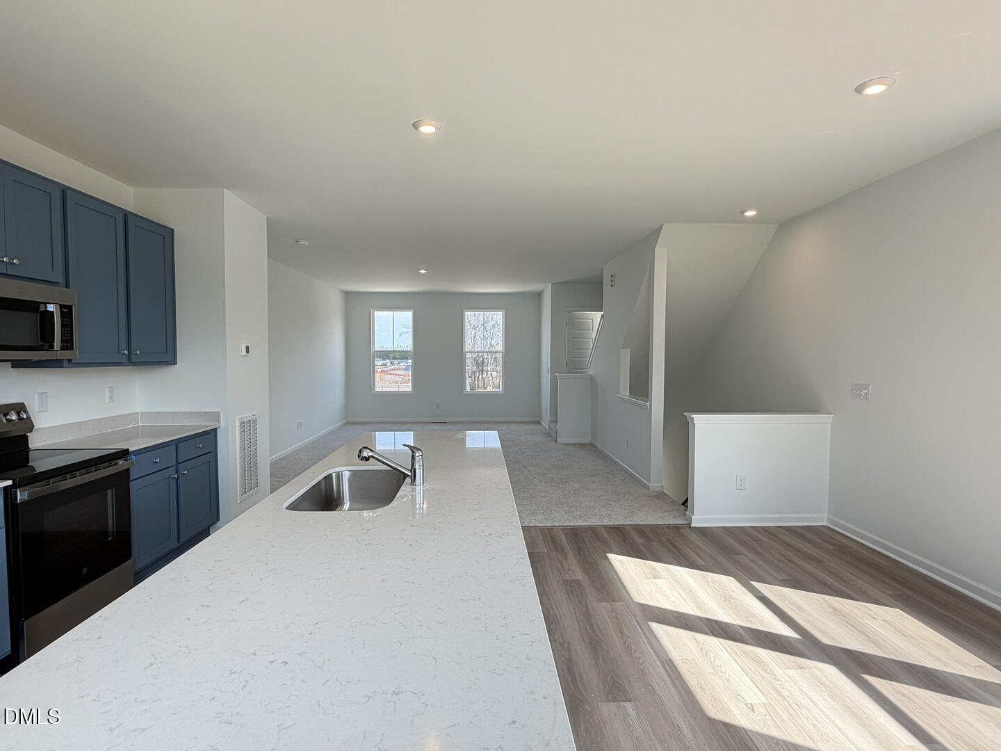 3328 Bomore Road Raleigh, NC 27610 - Photo 15 of 47 a kitchen with a sink and wooden floor