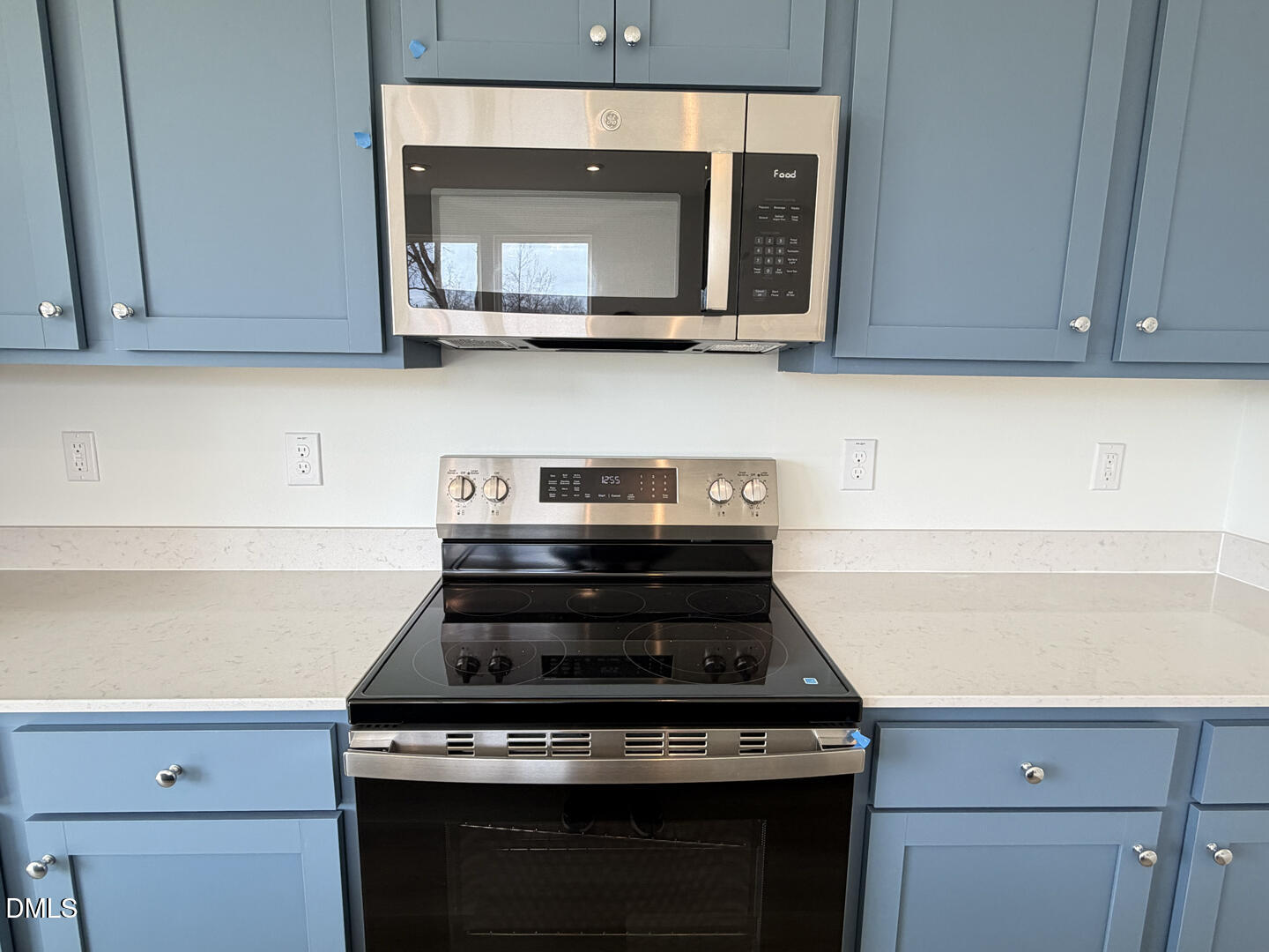 3328 Bomore Road Raleigh, NC 27610 - Photo 16 of 47 a kitchen with wooden cabinets and a stove top oven