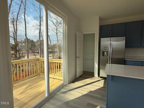 a bathroom with a glass door shower and a sink
