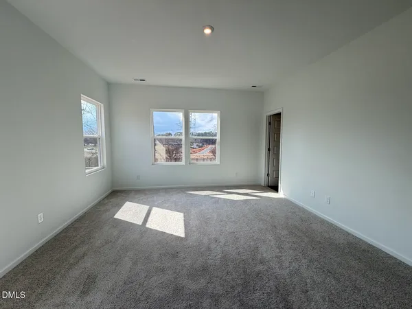 an empty room with windows and windows