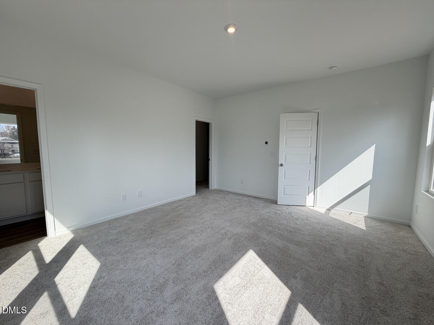 3328 Bomore Road Raleigh, NC 27610 - Photo 27 of 47 a view of an empty room with wooden floor and a window