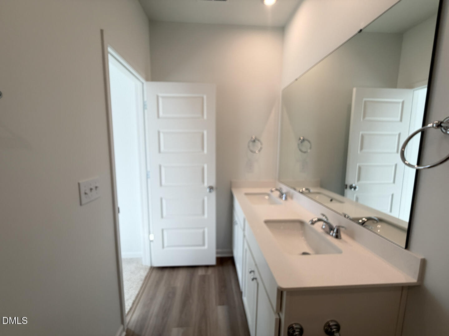 3328 Bomore Road Raleigh, NC 27610 - Photo 29 of 47 a bathroom with a sink and a mirror