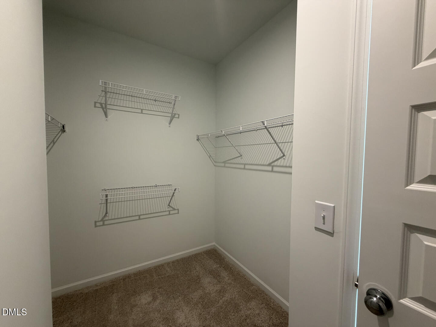 3328 Bomore Road Raleigh, NC 27610 - Photo 31 of 47 a view of storage and utility room with racks on the wall