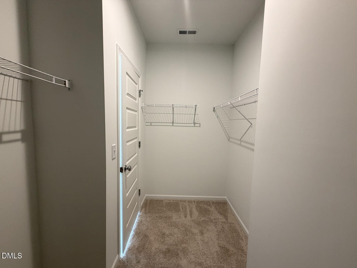 3328 Bomore Road Raleigh, NC 27610 - Photo 32 of 47 a view of storage and utility room with racks on the wall