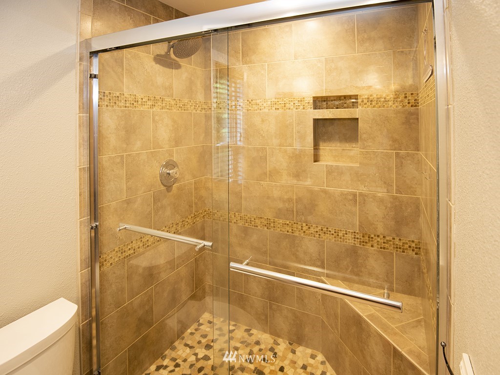 21922 Southeast 255th Place Maple Valley, WA 98038 - Photo 16 of 40 a bathroom with a shower