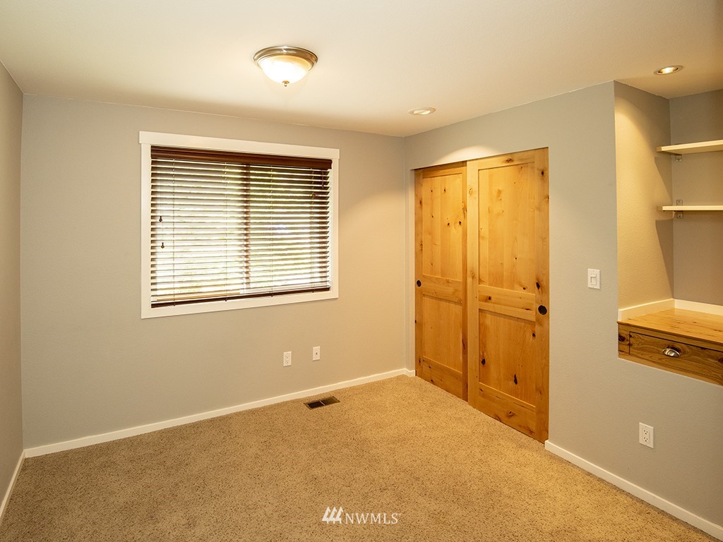21922 Southeast 255th Place Maple Valley, WA 98038 - Photo 17 of 40 a view of an empty room with a window
