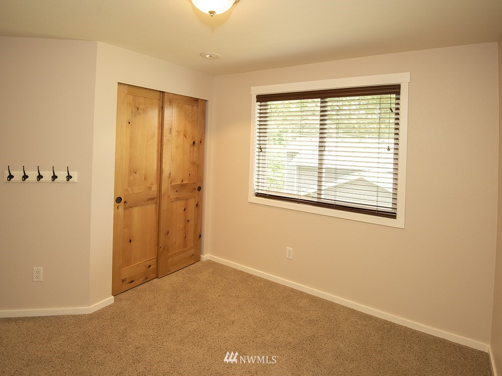 21922 Southeast 255th Place Maple Valley, WA 98038 - Photo 19 of 40 an empty room with windows
