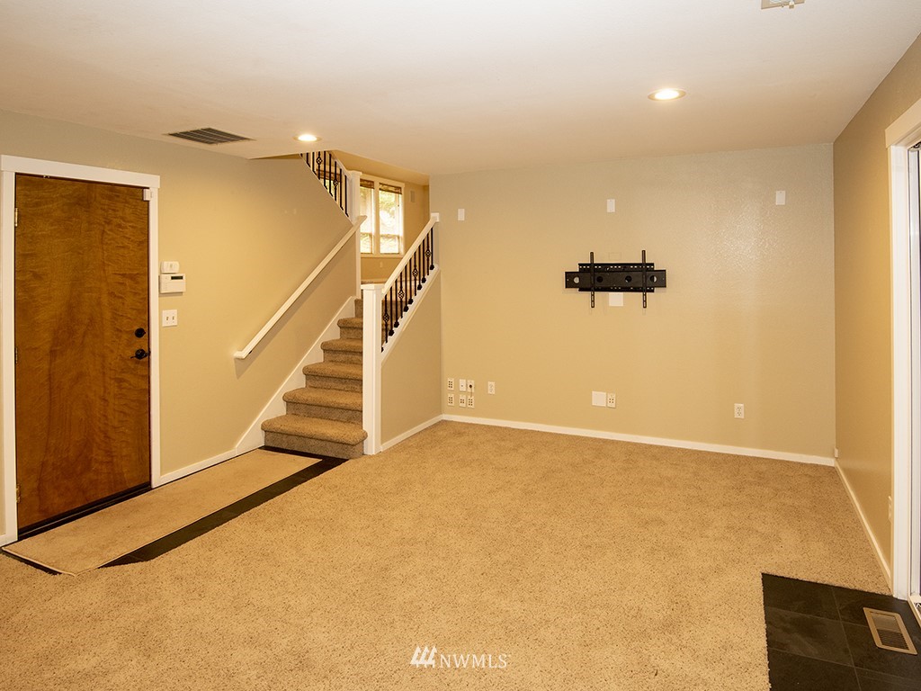 21922 Southeast 255th Place Maple Valley, WA 98038 - Photo 23 of 40 a view of an empty room with stairs