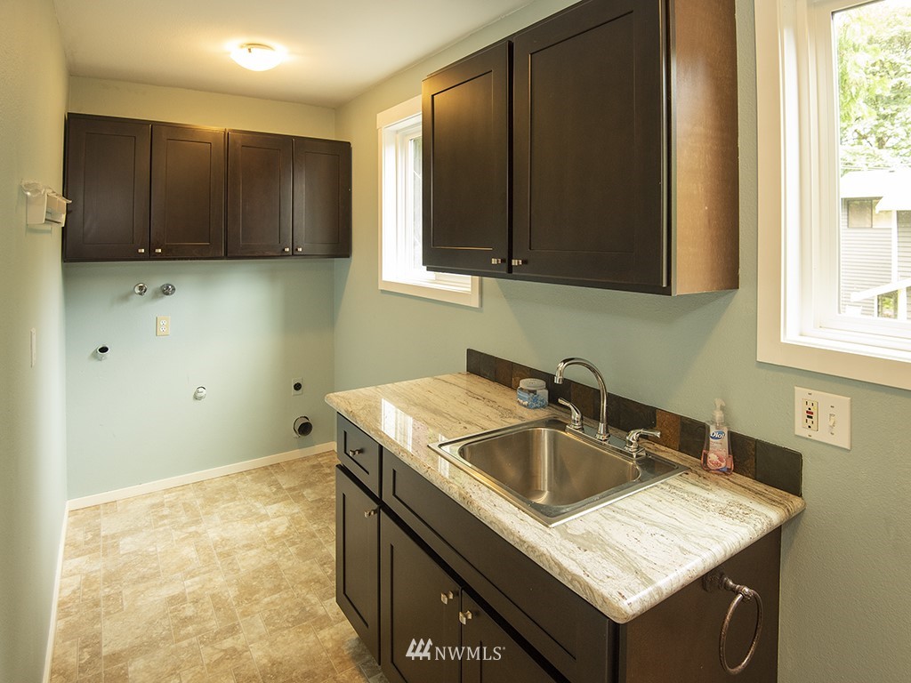 21922 Southeast 255th Place Maple Valley, WA 98038 - Photo 25 of 40 a bathroom with a sink and a vanity