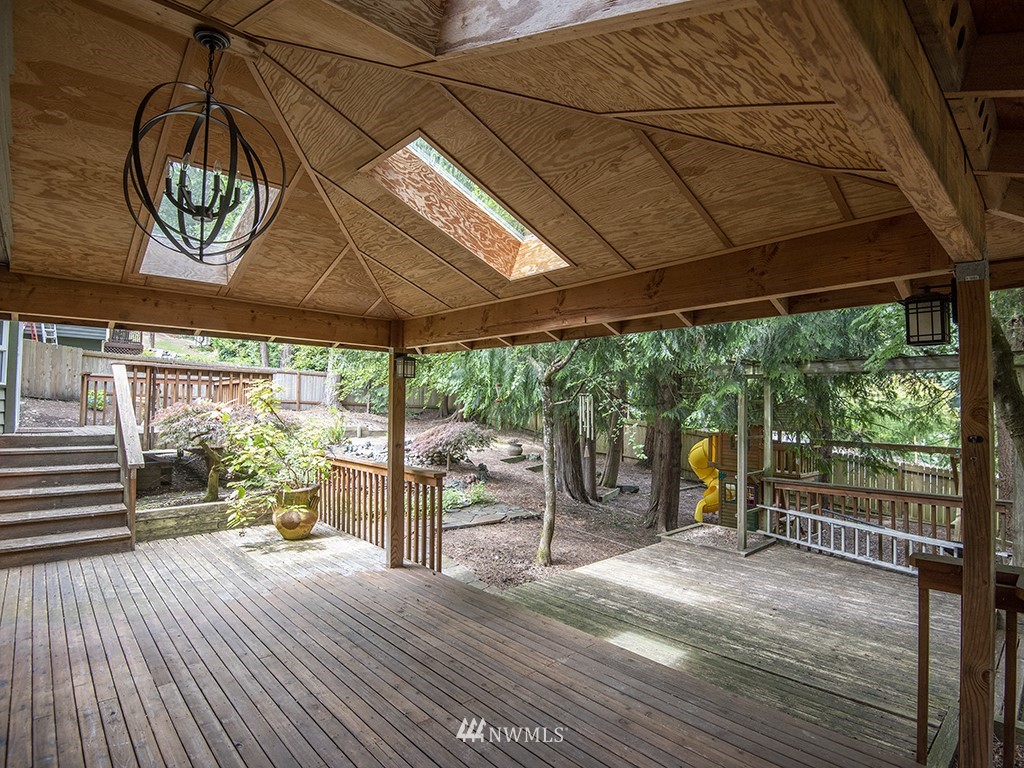 21922 Southeast 255th Place Maple Valley, WA 98038 - Photo 26 of 40 a view of a porch with wooden floor