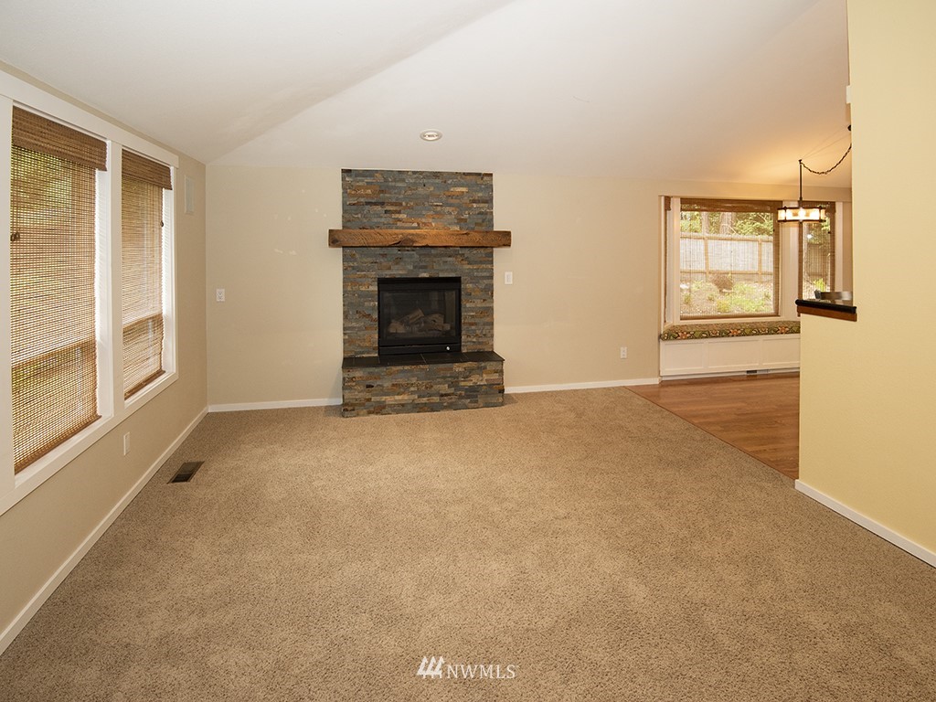 21922 Southeast 255th Place Maple Valley, WA 98038 - Photo 9 of 40 a view of empty room with a fireplace
