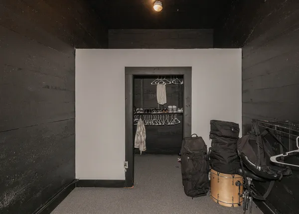 a bedroom with a bed and lamp