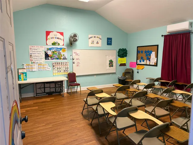 a room with furniture and a flat screen tv