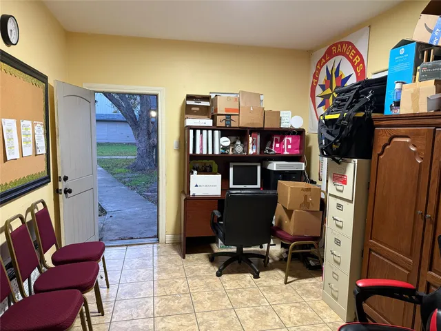 a living room with furniture a rug and a window