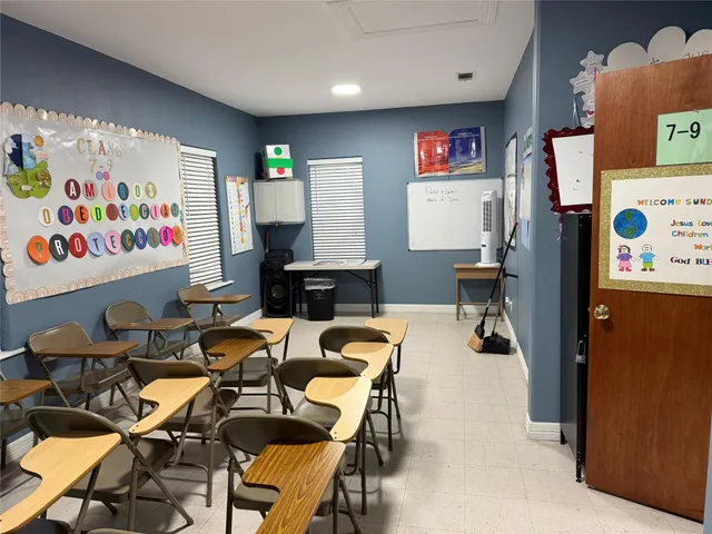 a view of a workspace with furniture and toys